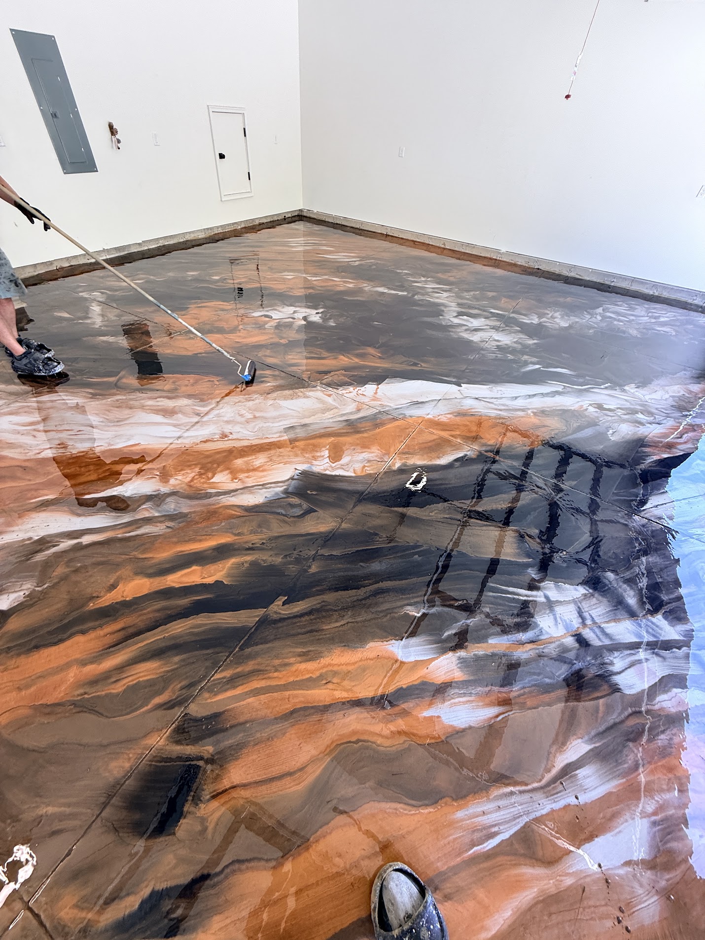 Copper metallic epoxy floor being installed - Utah
